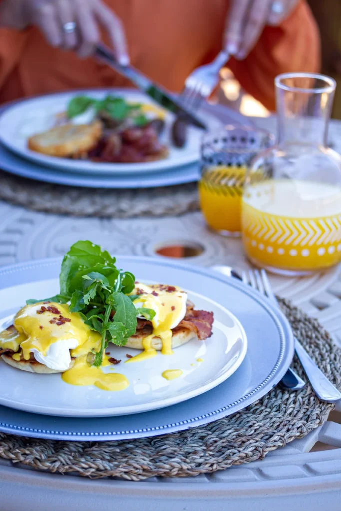 Gourmet breakfast served outdoors at Mont Eco Private Nature Reserve, featuring fresh local cuisine and views of the surrounding wilderness.